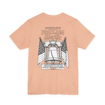 Proclaim Liberty Tee — Liberty Bell & Flags Bible Verse (Leviticus 25:10)