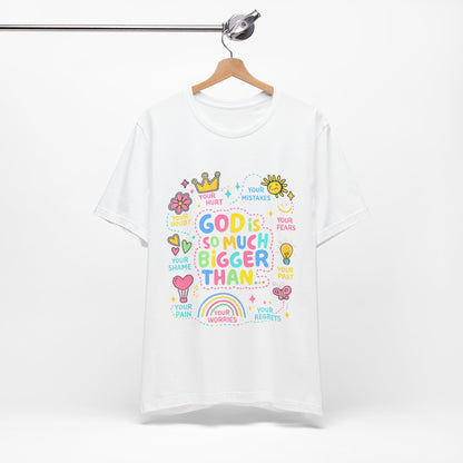 Christian T‑Shirt — "God Is So Much Bigger Than..." Pastel Faith Tee