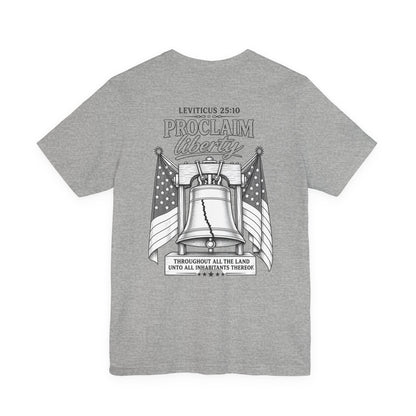 Proclaim Liberty Tee — Liberty Bell & Flags Bible Verse (Leviticus 25:10)