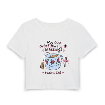 Women’s Baby Tee — “My Cup Overflows With Blessings” Psalms 23:5 Christian Graphic Tee