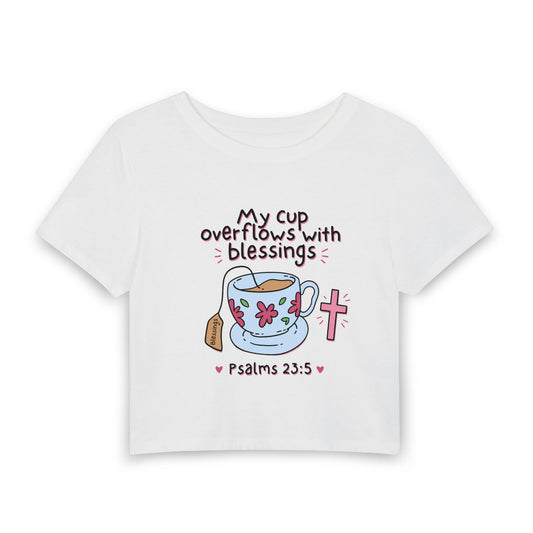 Women’s Baby Tee — “My Cup Overflows With Blessings” Psalms 23:5 Christian Graphic Tee